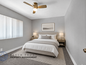 Hawthorne apartment for rent - A well-lit bedroom with a large bed and a ceiling fan.