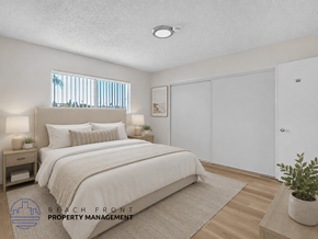 Inglewood apartment for rent - A bedroom with a large bed, a nightstand with lamps, a window with blinds, a rug, a potted plant, and a sliding door.