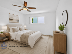 Long Beach apartment for rent - A bedroom with a bed, nightstand, and a ceiling fan.