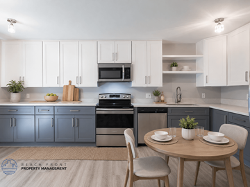Long Beach apartment for rent - A modern kitchen with a dining table set for two.