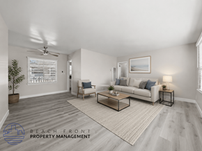 Santa Ana apartment for rent - A living room with a couch, chair, and coffee table.