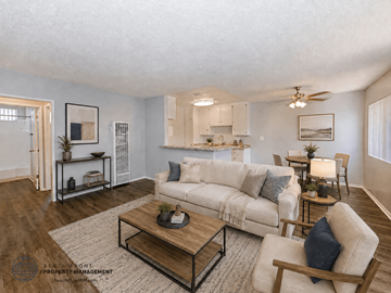Gardena apartment for rent - A living room with a white couch and a coffee table.
