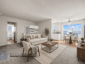 Hawthorne apartment for rent - A living room with a white couch, a coffee table, and a dining table with chairs.