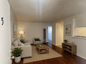 Wilmington apartment for rent - A living room with a couch, chair, and coffee table.