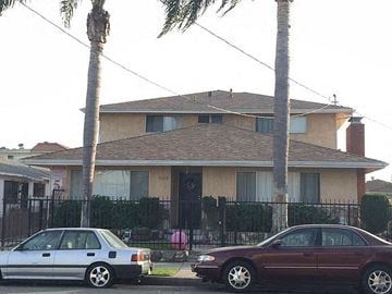 Hawthorne apartment for rent - a house with two cars parked in front of it