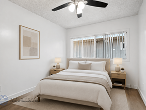 Gardena apartment for rent - A bedroom with a large bed and a ceiling fan.