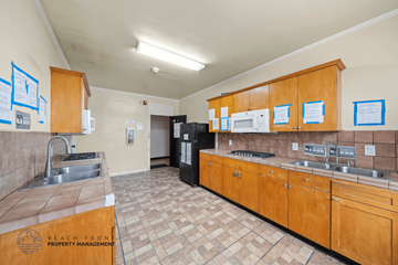 Los Angeles apartment for rent - A kitchen with wooden cabinets and a tile floor.