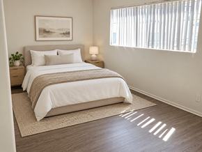 Los Angeles apartment for rent - A bedroom with a large bed and a painting on the wall.