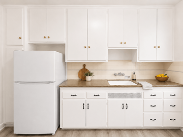 Long Beach apartment for rent - A white refrigerator stands next to a kitchen counter with a bowl of fruit on it.