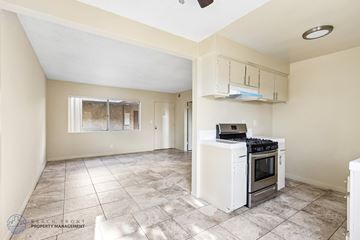 Hawthorne apartment for rent - A kitchen with a stove top oven and a window.