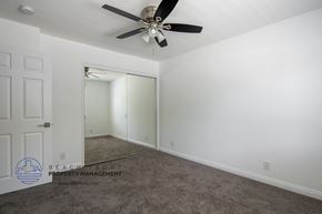 Los Angeles apartment for rent - a bedroom with a ceiling fan and a closet