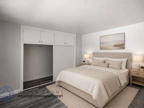 Long Beach apartment for rent - A bedroom with a large bed, a fireplace, and a painting on the wall.