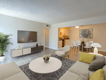 Downey apartment for rent - A living room with a white coffee table and grey couches.