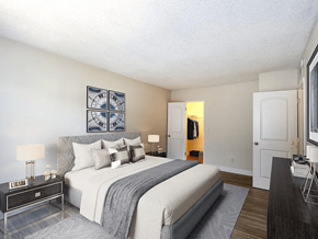 Downey apartment for rent - A bedroom with a large bed and a painting on the wall.