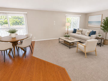 Pico Rivera apartment for rent - A living room with a white couch, a coffee table, and a dining table with chairs.