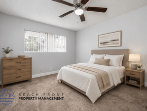 Long Beach apartment for rent - A bedroom with a bed, nightstand, and a ceiling fan.