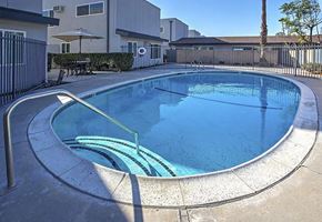 Anaheim apartment for rent - A small round pool with a metal railing around it.