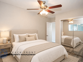 Torrance apartment for rent - A bedroom with a bed, a ceiling fan, and a mirror.
