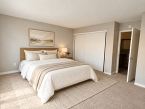 Westminster apartment for rent - A bedroom with a large bed and a painting on the wall.