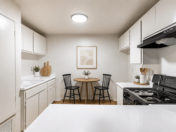 Pomona apartment for rent - A kitchen with a table and chairs in the middle.