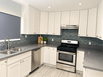 Redondo Beach apartment for rent - A kitchen with white cabinets and a stainless steel sink.