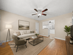 Downey apartment for rent - A living room with a couch, chair, and coffee table.