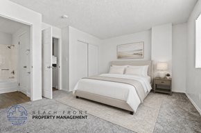 Torrance apartment for rent - A bedroom with a large bed and a nightstand with a lamp.