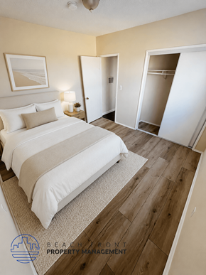 Torrance apartment for rent - A bedroom with a large bed and a wooden floor.