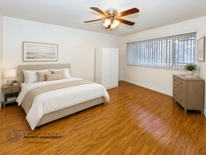 Los Angeles apartment for rent - A bedroom with a bed, dresser, and ceiling fan.