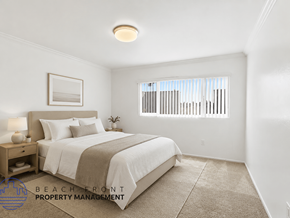 Anaheim apartment for rent - A well-lit bedroom with a large bed and a window with blinds.