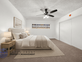 Hawthorne apartment for rent - A bedroom with a bed, nightstand, and window.