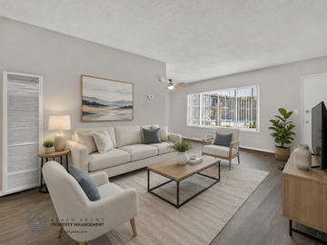 La Puente apartment for rent - A well-lit living room with a large painting on the wall and a comfortable seating area.
