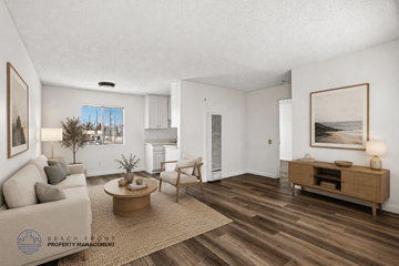 Gardena apartment for rent - A living room with a couch, coffee table, and a painting on the wall.