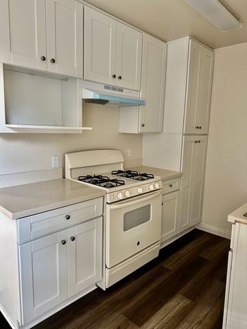 Gardena apartment for rent - A white kitchen with a stove and cabinets.