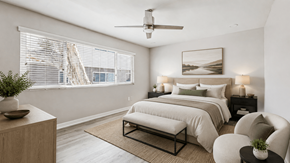 Torrance townhouse for rent - A bedroom with a large bed, a ceiling fan, and a window with blinds.