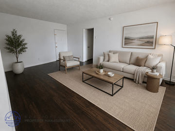 Inglewood apartment for rent - A living room with a white couch, a coffee table, and a painting on the wall.