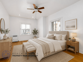 Los Angeles apartment for rent - A well-lit bedroom with a large bed and a ceiling fan.