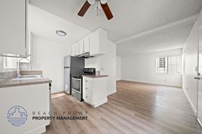 Manhattan Beach apartment for rent - A kitchen with a stove top oven and a refrigerator.