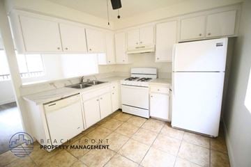 Hawthorne apartment for rent - a white kitchen with white appliances and white cabinets