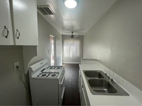 Wilmington apartment for rent - an empty kitchen with a stove and a sink