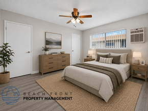Downey apartment for rent - A bedroom with a bed, dresser, and ceiling fan.
