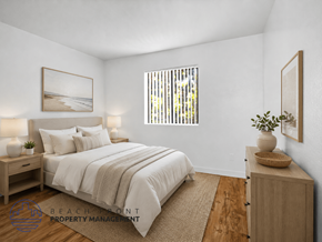 Wilmington apartment for rent - A well-lit bedroom with a large bed and a wooden cabinet.