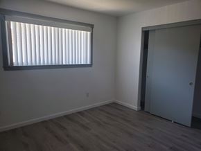 Huntington Beach apartment for rent - A room with a window and a door.
