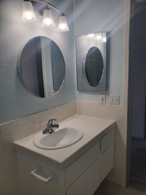 Huntington Beach apartment for rent - A bathroom with a sink and mirror.