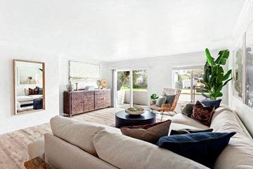 Newport Beach apartment for rent - A living room with a white couch and a coffee table.