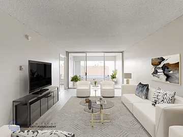 Inglewood apartment for rent - A living room with a white couch, a television, and a coffee table.