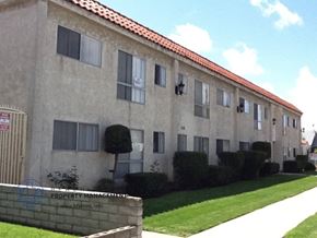 Harbor City apartment for rent - an apartment building with a lawn in front of it