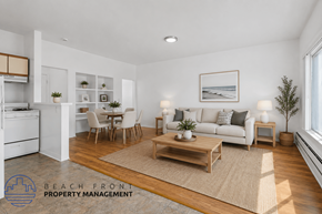 Los Angeles apartment for rent - A well-lit living room with a dining area and kitchen in the background.