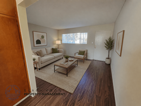 Gardena apartment for rent - A living room with a couch, chair, and coffee table.
