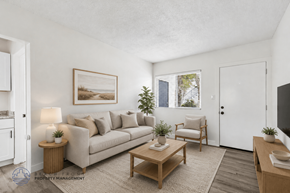 Hawthorne apartment for rent - A living room with a couch, chair, and table.